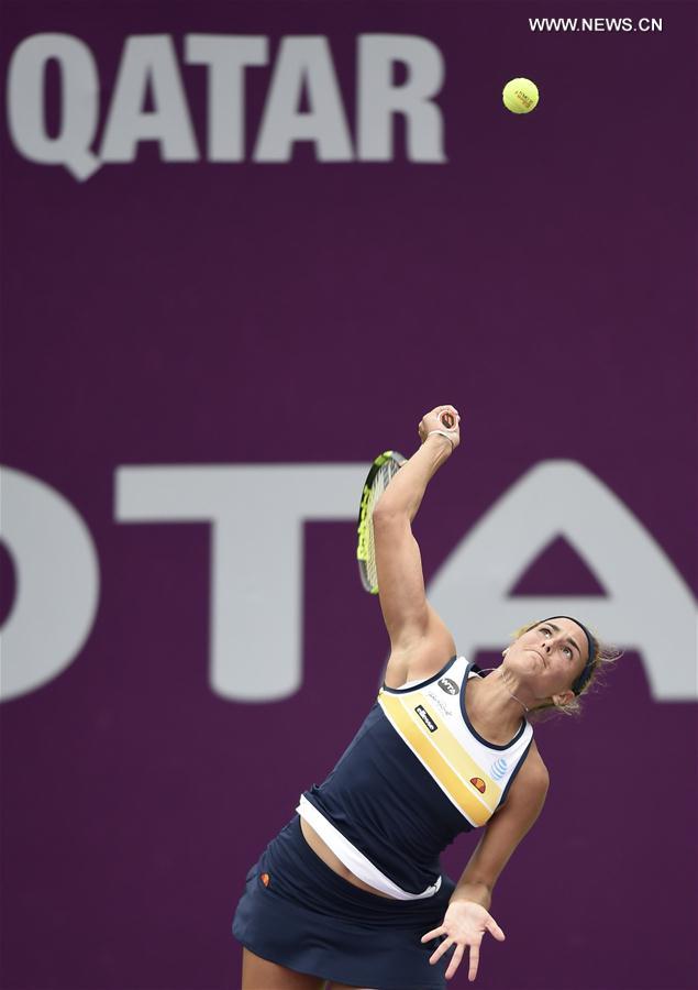 Monica Puig of Puerto Rico serves during the singles second round match against Yulia Putintseva of Kazakhstan at WTA Qatar Open 2017 at the International Khalifa Tennis Complex of Doha, Qatar, Feb. 15, 2017. 