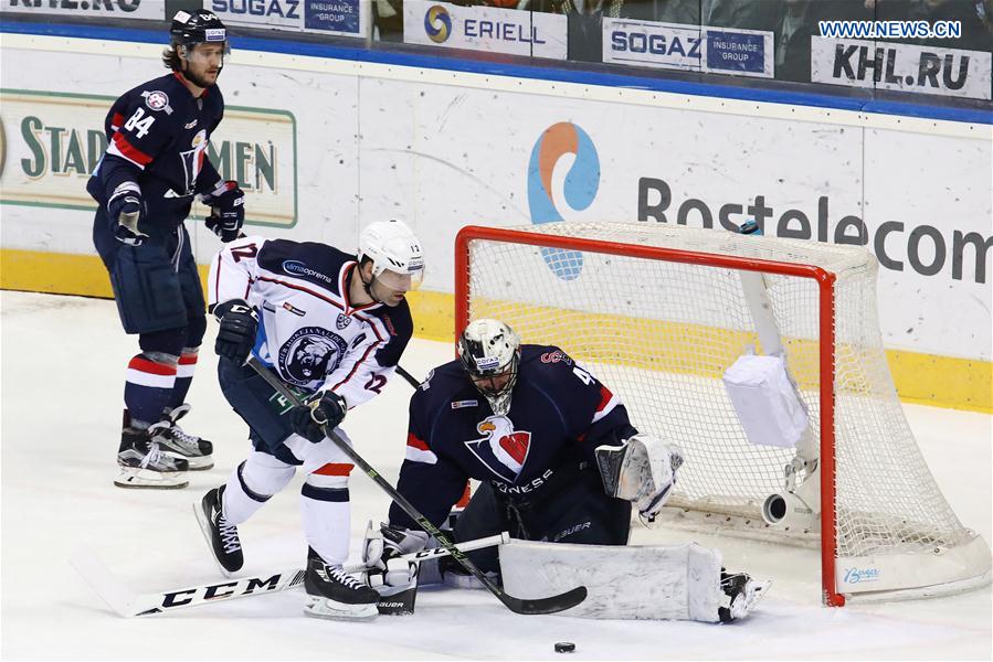 HC Slovan Bratislava Justin Pogge (R) saves as Alexandre Giroux (C) of Medvescak Zagreb attacks during their Kontinental Hockey League (KHL) match at Ondrej Nepela Arena in Bratislava, Slovakia, on Feb.15, 2017. 