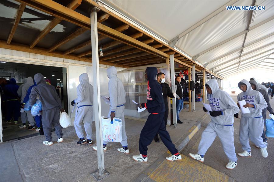Senegalese immigrants enter Mitiga International Airport before being deported in Tripoli, capital of Libya, on Feb. 16, 2017. 