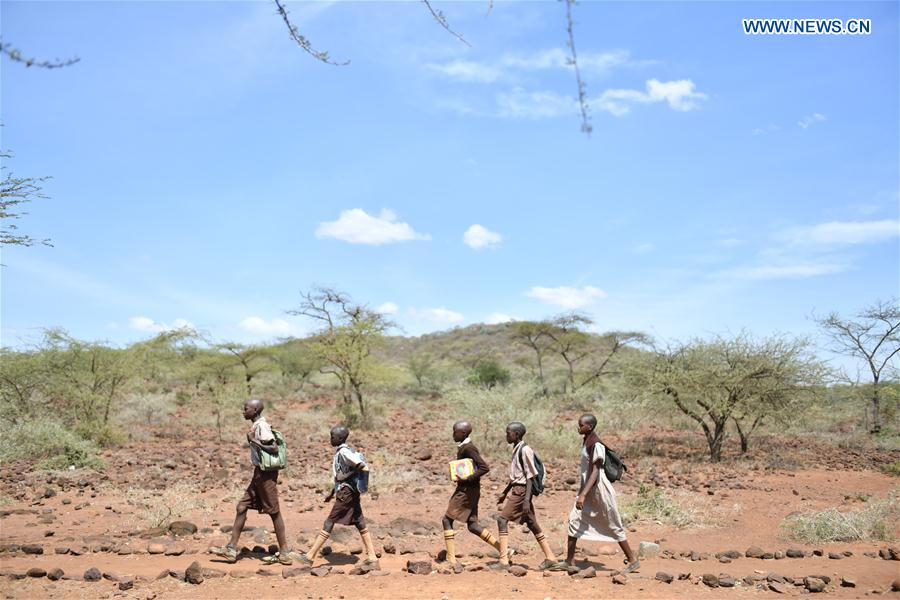 Students from Grade Five walk on the campus of Olomayiana West Primary School in Kajiado County, Kenya, on Feb. 15, 2017. 