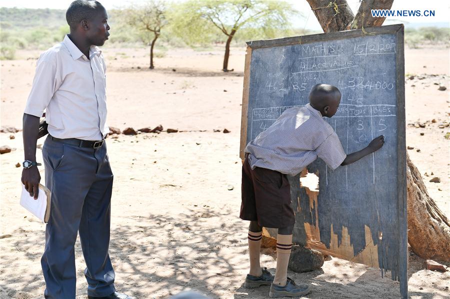 A student answers a question on the blackboard at Olomayiana West Primary School in Kajiado County, Kenya, on Feb. 15, 2017. 