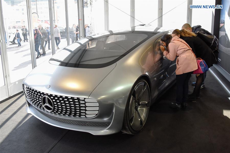 Visitors look at a Mercedes Benz concept electric car F015 in Monte Carlo, Monaco on Feb. 16, 2017.