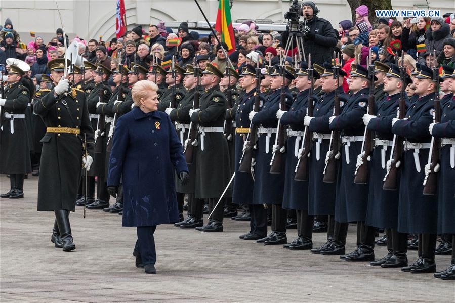 Lithuania's President Dalia Grybauskaite reviews the guard of honor on the commemoration of the 99th anniversary of Independence Day of Lithuania in Vilnius, Lithuania, Feb. 16, 2017. 