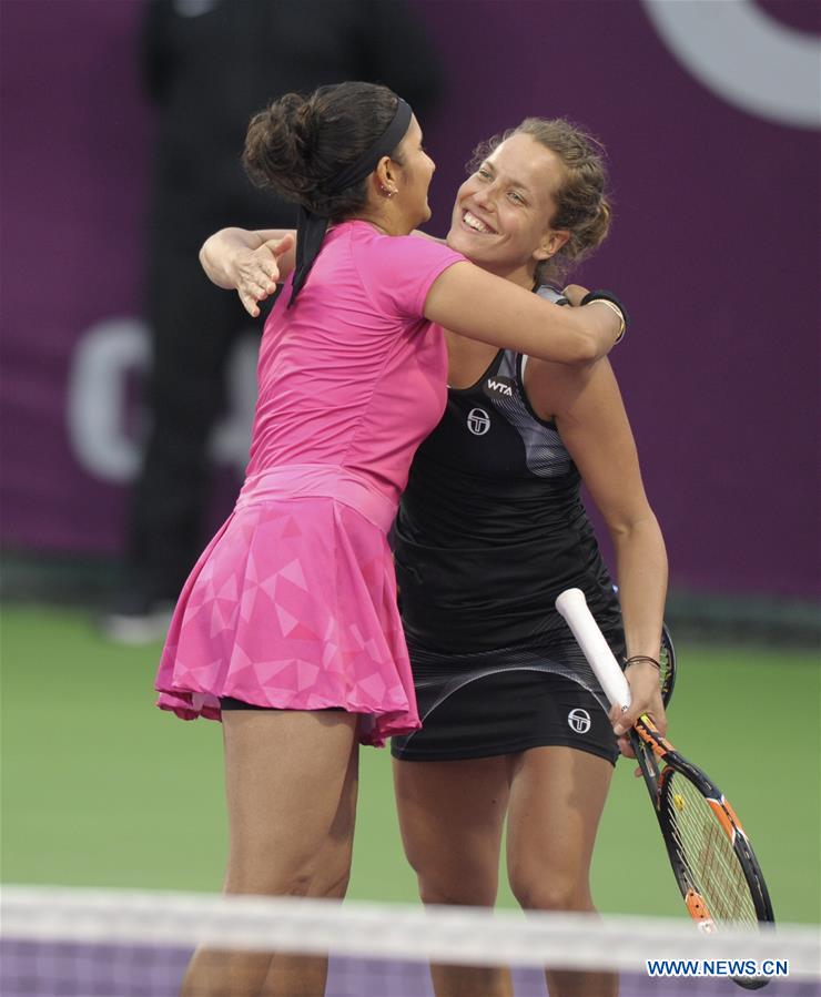 Sania Mirza (L) of India and Barbora Strycova of Czech Republic celebrate after winning the women's doubles 1st round match against Xu Yifan of China and Raquel Atawo of the United States at WTA Qatar Open 2017 at the International Khalifa Tennis Complex of Doha, Qatar, Feb. 16, 2017. Mirza and Strycova won 2-0. (Xinhua/Nikku) 