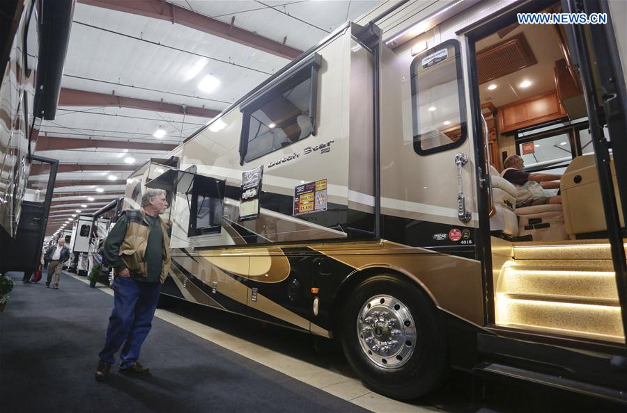 A man watches a recreation vehicle during the Earlybird RV Show in Vancouver, Canada, Feb. 17, 2017.