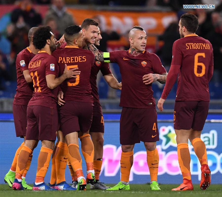 Roma's players celebrate after scoring during a Serie A soccer match between Roma and Torino in Rome, Italy, Feb. 19, 2017.