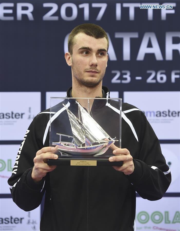 Tomislav Pucar of Croatia poses with his trophy after the U21 Men's singles final against Lam Siu Hang of Hong Kong, China, at the ITTF Seamaster 2017 World Tour Platinum Qatar Open, in Doha, capital of Qatar, Feb. 22, 2017. 
