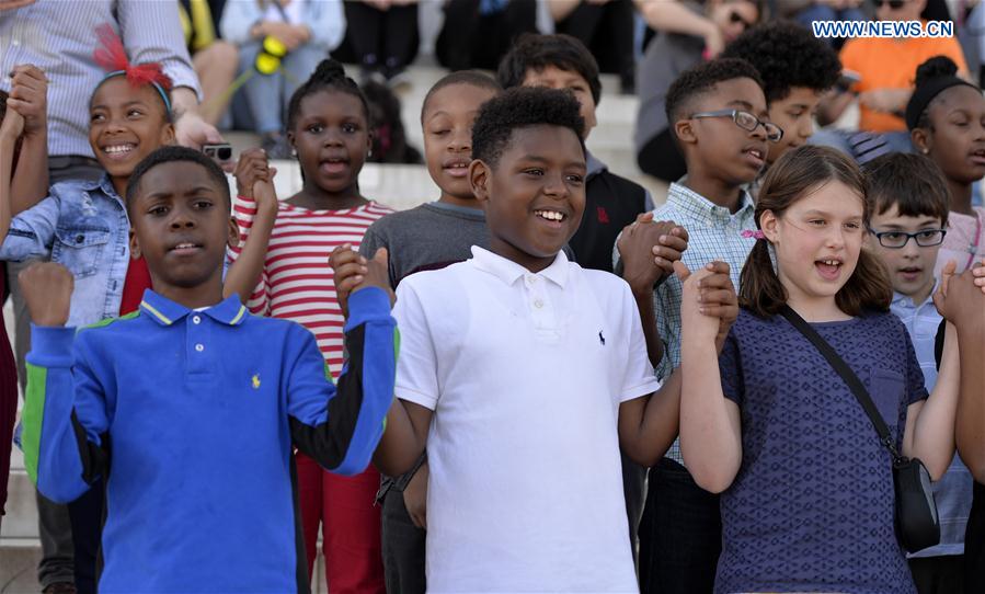 Students of Watkins Elementary School participate in the 13th annual reading of Martin Luther King's 'I Have a Dream' speech event at Lincoln Memorial in Washington D.C., capital of the United States, on Feb. 24, 2017 to commemorate the civil rights leader.