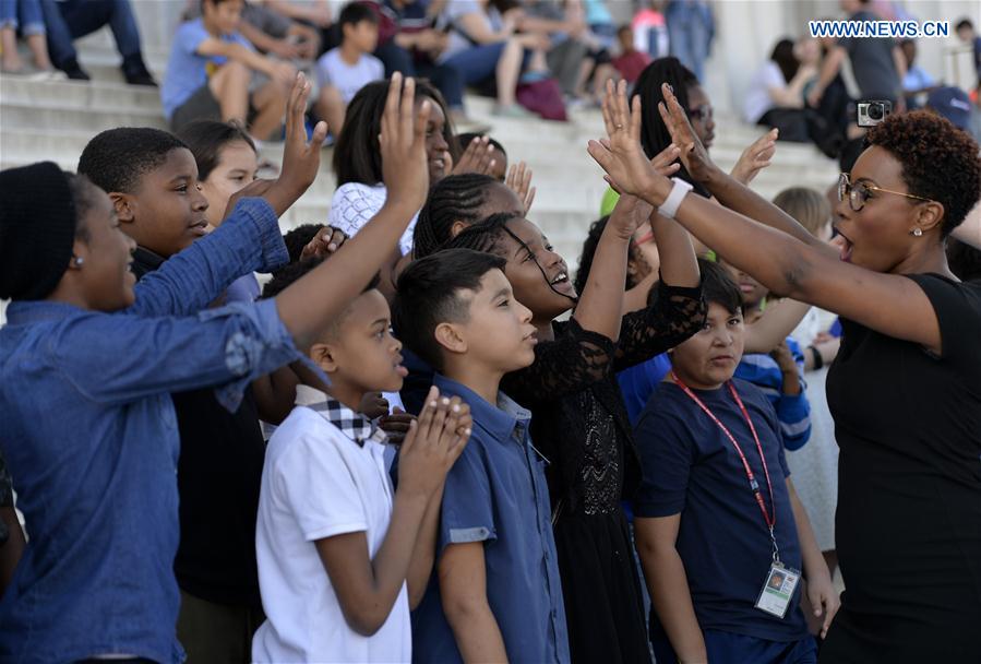 Students of Watkins Elementary School and their teacher participate in the 13th annual reading of Martin Luther King's 'I Have a Dream' speech event at Lincoln Memorial in Washington D.C., capital of the United States, on Feb. 24, 2017 to commemorate the civil rights leader. 