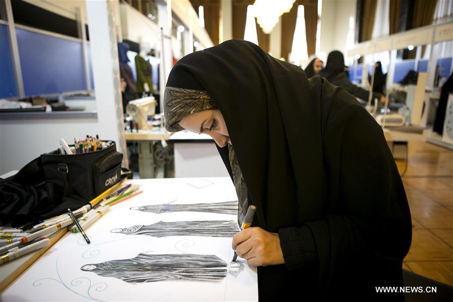 A woman visits the 6th Fadjr international Fashion and Clothing Festival in Tehran, capital of Iran, on Feb. 27, 2017. 
