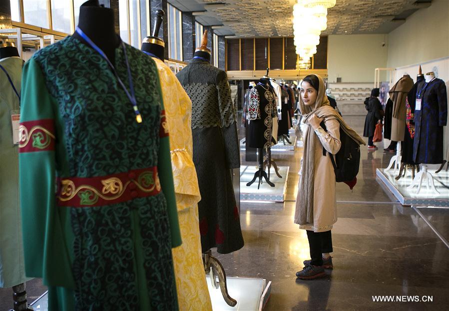 A woman visits the 6th Fadjr international Fashion and Clothing Festival in Tehran, capital of Iran, on Feb. 27, 2017. 