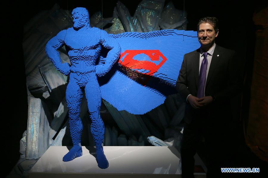 Artist Nathan Sawaya poses for a photo with his work 'Superman: Blue' made of Lego bricks during the exhibition 'The Art of Brick: DC Super Heroes' by artist Nathan Sawaya, on the South Bank in London, Britain, on Feb. 28, 2017. The exhibition featured sculptures based on the DC Comics universe and used more than 2 million Lego bricks. 