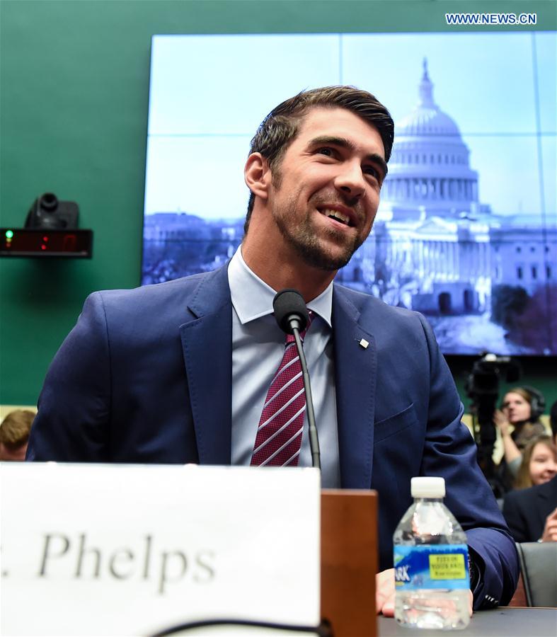 U.S. Olympic gold medalist Michael Phelps prepares to testify before the House Energy and Commerce Subcommittee on Oversight and Investigations during a hearing on 'Ways to Improve and Strengthen the International Anti-Doping System' on the Capitol Hill in Washington D.C., the United States, Feb. 28, 2017. 