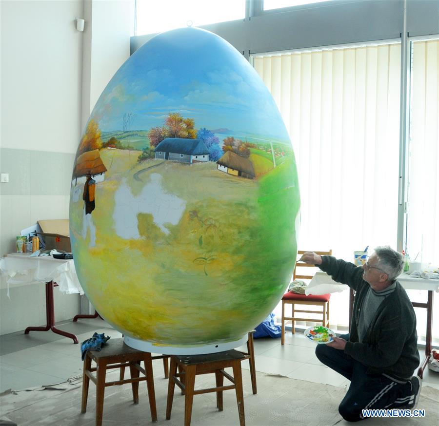 A local painter works on a large Easter egg in Koprivnica, Croatia, Feb. 28, 2017. Nearly 70 Easter eggs painted in Croatian Naive art style by the painters of Koprivnica have been displayed in many cities around the world during Easter in last 10 years.