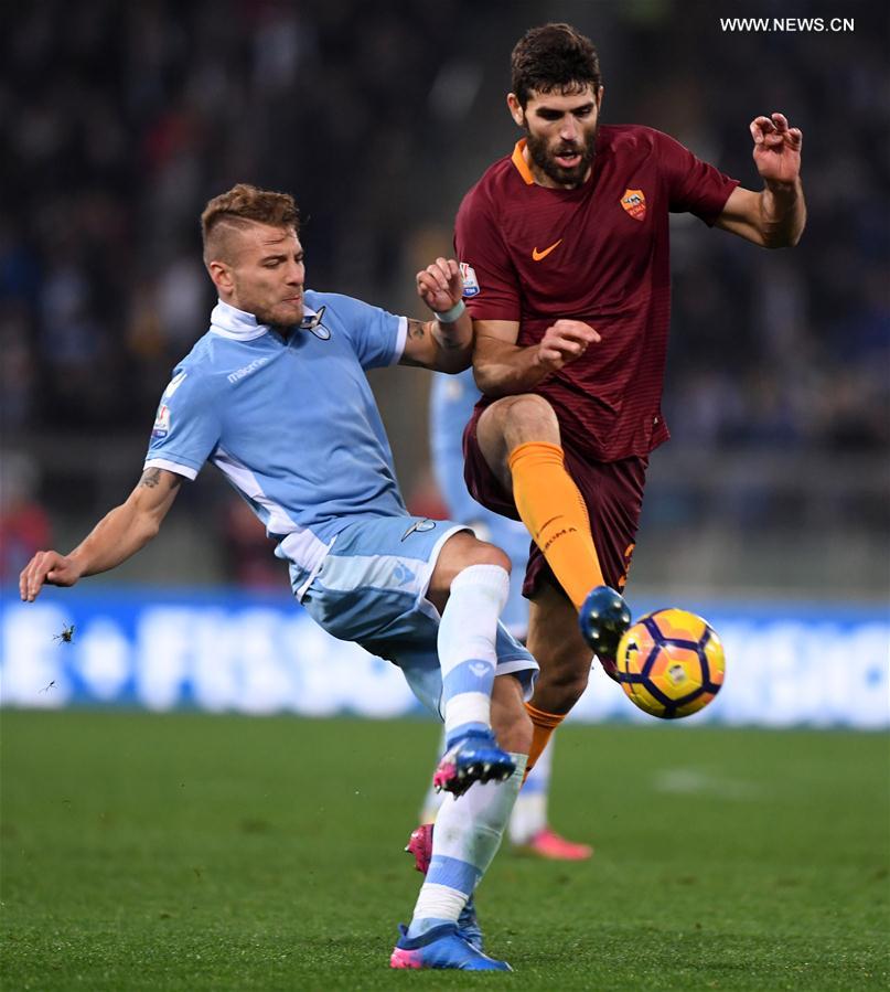 Lazio's Felipe Anderson (L) competes with Roma's Antonio Rudiger during the Italian Cup first leg semifinal football match in Rome, Italy, March 1, 2017. 