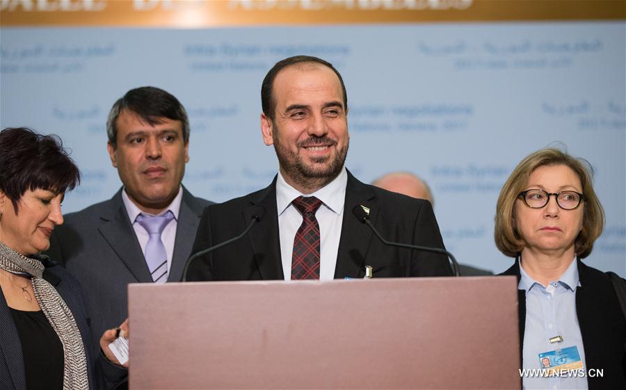 Syria's opposition delegation leader Nasr al-Hariri (front) attends a press conference at Palais des Nations in Geneva, Switzerland, March 3, 2017.