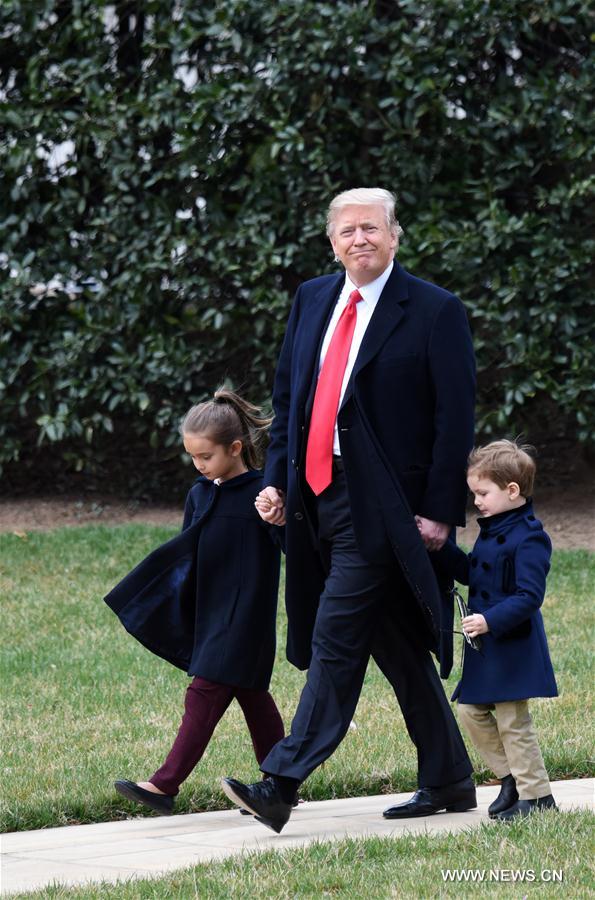 U.S. President Donald Trump walks with his grandchildren Arabella Kushner (L) and Joseph Kushner (R) to board Marine One from the White House in Washington D.C., the United States, March 3, 2017.