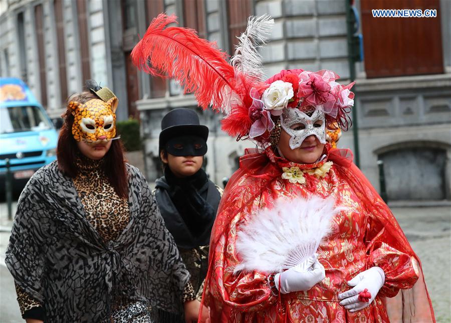 People take part in the mask carnival in Brussels, Belgium, March 4, 2017. 