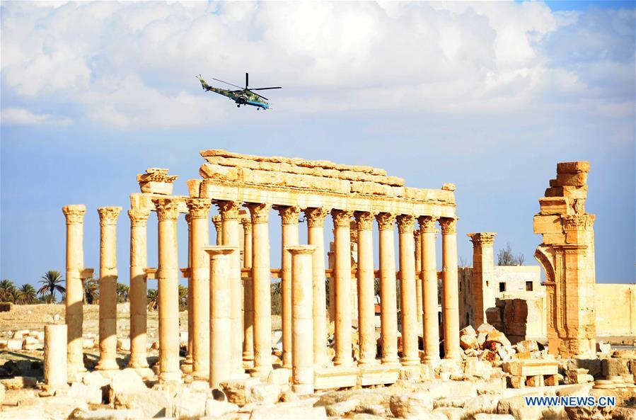 A Russian helicopter hovers over the ancient city of Palmyra, central Syria, on March 4, 2017. The Syrian army announced in a statement that the Syrian forces captured the ancient city of Palmyra in central Syria on Thursday after battles with the Islamic State (IS) group. 