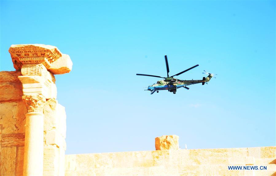 A Russian helicopter hovers over the ancient city of Palmyra, central Syria, on March 4, 2017. The Syrian army announced in a statement that the Syrian forces captured the ancient city of Palmyra in central Syria on Thursday after battles with the Islamic State (IS) group.