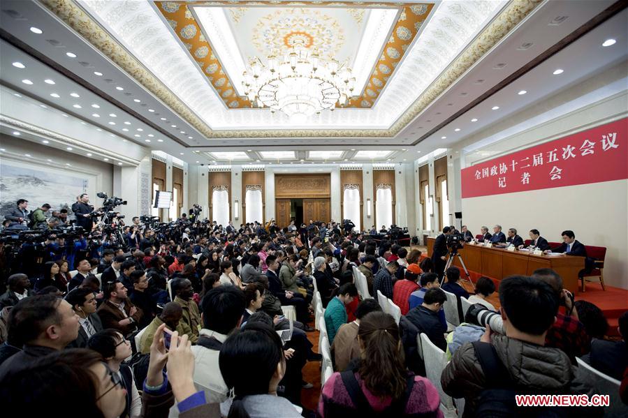 Li Yining, Chen Xiwen, Yang Kaisheng, Chang Zhenming and Qian Yingyi, members of the 12th National Committee of the Chinese People's Political Consultative Conference (CPPCC), attend a press conference for the fifth session of the 12th CPPCC National Committee on promoting stable and healthy economic growth at the Great Hall of the People in Beijing, capital of China, March 6, 2017.