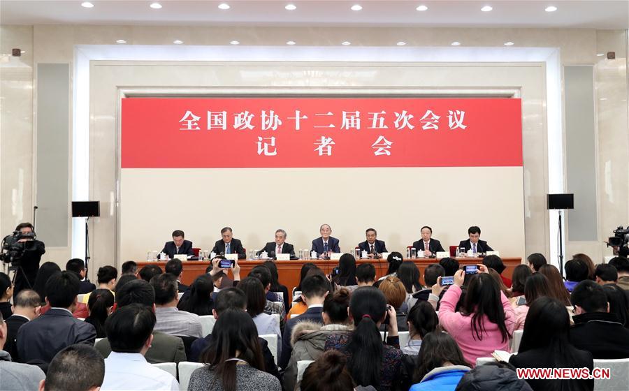 Li Yining, Chen Xiwen, Yang Kaisheng, Chang Zhenming and Qian Yingyi, members of the 12th National Committee of the Chinese People's Political Consultative Conference (CPPCC), attend a press conference for the fifth session of the 12th CPPCC National Committee on promoting stable and healthy economic growth at the Great Hall of the People in Beijing, capital of China, March 6, 2017. (Xinhua/Zhang Yuwei)