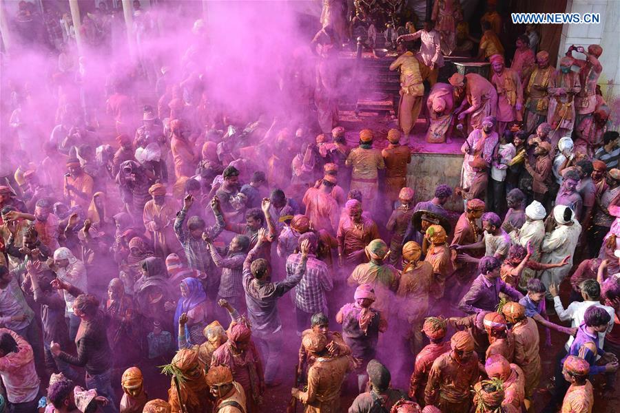 Villagers daubed with color powder celebrate Lath Mar Holi in Mathura, northern Indian state of Uttar Pradesh, on March 7, 2017.