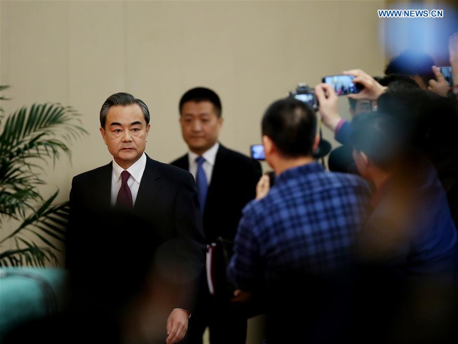 Chinese Foreign Minister Wang Yi arrives for a press conference on China's foreign policy and foreign relations for the fifth session of the 12th National People's Congress in Beijing, capital of China, March 8, 2017.