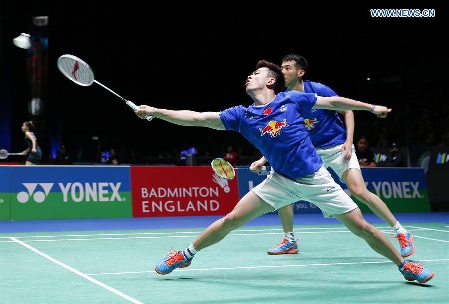 China's Lu Kai/Zheng Siwei (front) compete during the men's doubles first round match with Mathias Boe/Carsten Mogensen of Denmark at All England Open Badminton 2017 in Birmingham, Britain on March 8, 2017. 