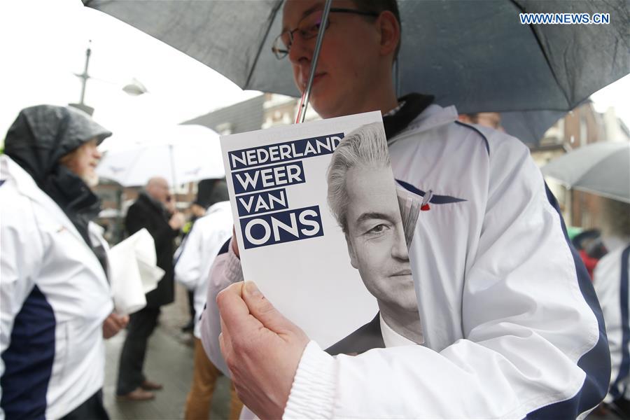 A supporter of Geert Wilders, leader of the right-wing Dutch populist Party for Freedom (PVV), attends a campaign of Geert Wilders for the upcoming general elections in Breda, the Netherlands, on March 8, 2017.