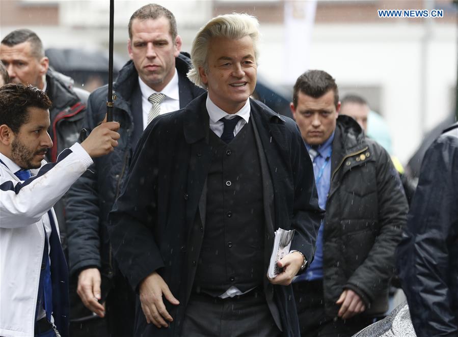 Leader of the right-wing Dutch populist Party for Freedom (PVV) Geert Wilders (C) attends a campaign for the upcoming general elections in Breda, the Netherlands, on March 8, 2017. 