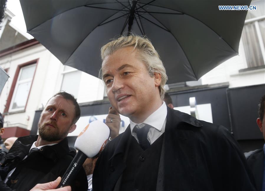 Leader of the right-wing Dutch populist Party for Freedom (PVV) Geert Wilders (Front) speaks to media during a campaign for the upcoming general elections in Breda, the Netherlands, on March 8, 2017.