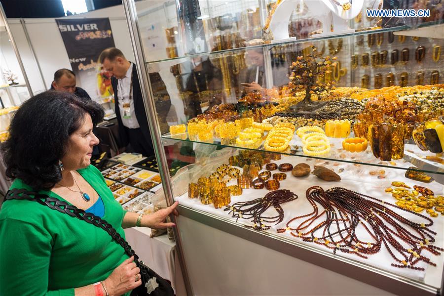 A customer selects amber products on the 'Amber Trip' exhibition in Vilnius, Lithuania, on March 8, 2017. 