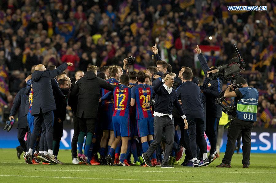 Luis Enrique (Front) of Barcelona celebrates with his team after winning the UEFA Champions League Round of 16 second leg match between Barcelona and Paris Saint-Germain in Barcelona, Spain on March 8, 2017. 