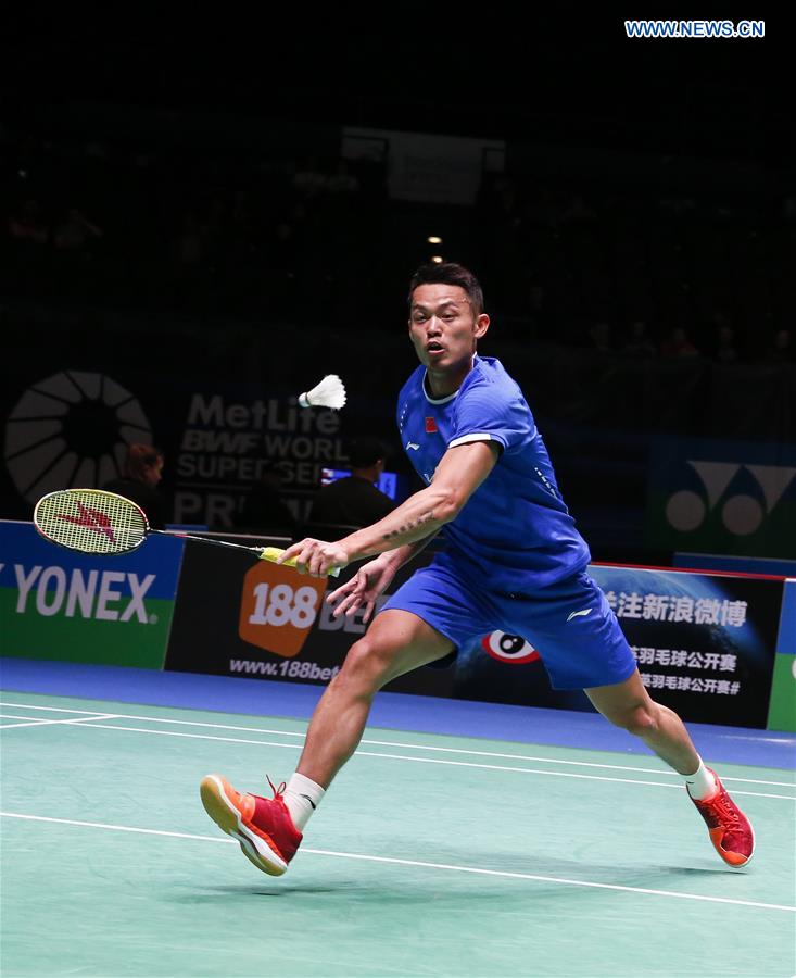 Lin Dan of China returns the shuttlecock during the men's singles first round match with Zulfadli Zulkiffli of Malaysia at All England Open Badminton 2017 in Birmingham, Britain, on March 8, 2017. 