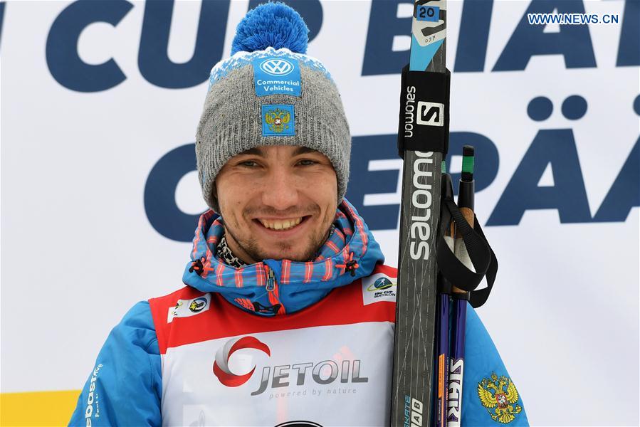 Alexandr Loginov of Russia poses during the awarding ceremony of Men's 10km sprint race of IBU Cup 2016/2017 in Otepaa, Estonia, March 11, 2017.