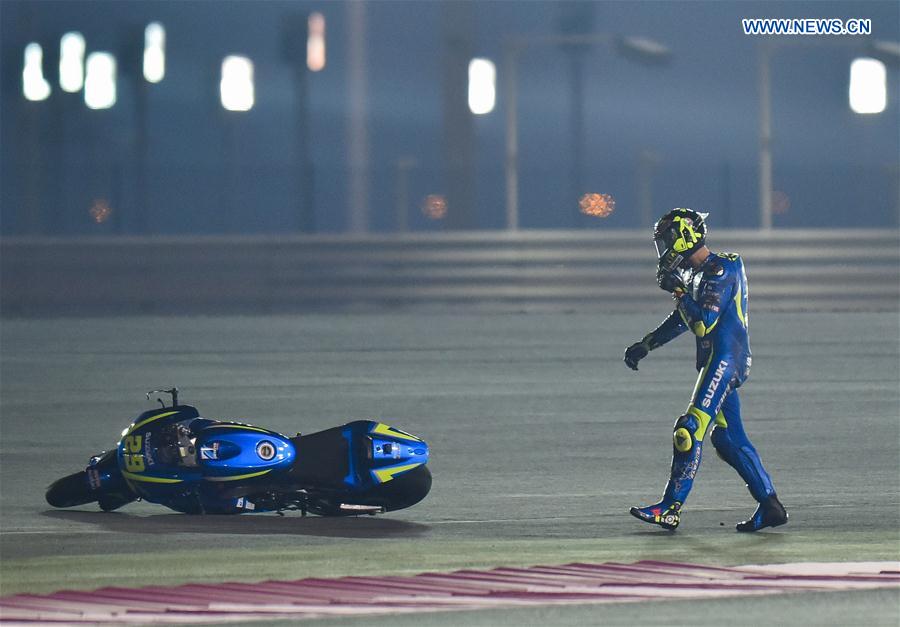 Italian rider Andrea Iannone of Team Suzuki ECSTAR reacts after crashing out during the pre-season test at the Losail International Circuit in Qatar's capital Doha on March 11, 2017, ahead of Grand Prix of Qatar which will be held from March 23 to 26.