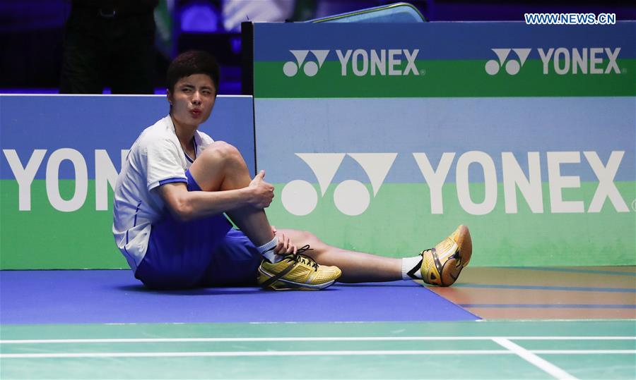Shi Yuqi of China is injured during the men's singles final with Lee Chong Wei of Malaysia at All England Open Badminton Championships 2017 in Birmingham, Britain on March 12, 2017.
