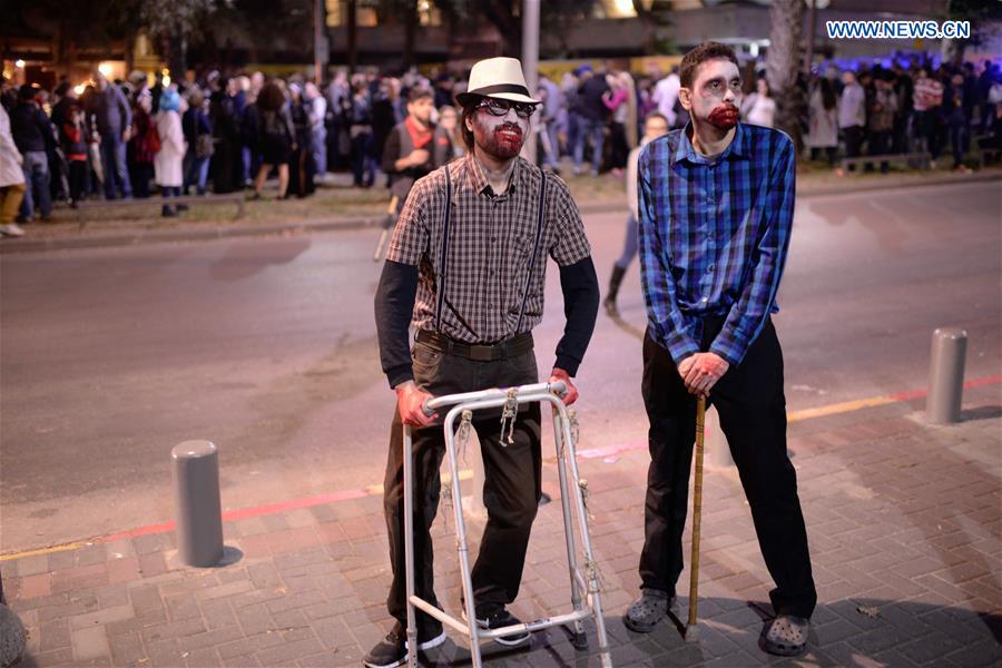 People take part in the 8th annual Zombie Walk in central Tel Aviv, Israel on March 11, 2017. 