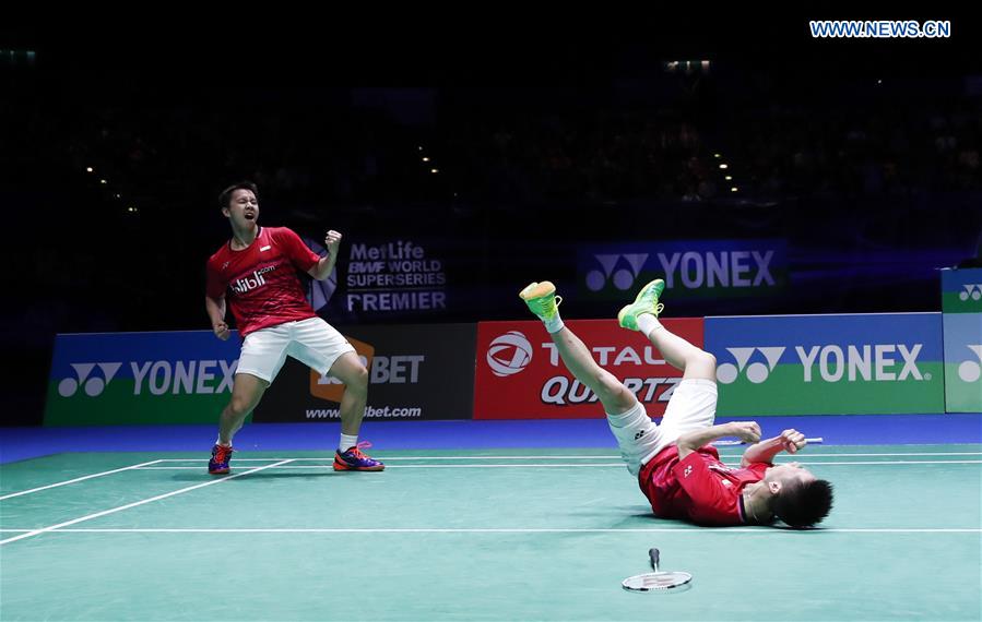 Marcus Fernaldi Gideon/Kevin Sanjaya Sukamuljo (R) of Indonesia celebrate victory during the men's doubles final with Li Junhui/Liu Yuchen of China at All England Open Badminton Championships 2017 in Birmingham, Britain on March 12, 2017.