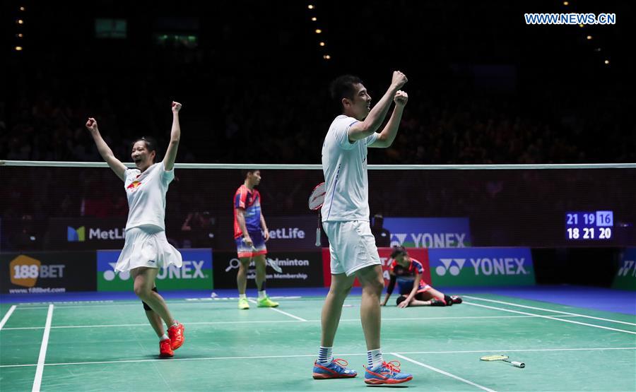 Lu Kai(R)/Huang Yaqiong of China celebrate after the mixed doubles final with Peng Soon Chan/Liu Ying Goh of Malaysia at All England Open Badminton Championships 2017 in Birmingham, Britain on March 12, 2017. 