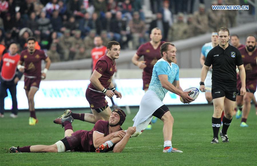 Georgia's B. Gorgadze (bottom) vies with Russia's K. Uzunov (2nd R) during the match of Rugby Europe Champioships 2017 between Georgia and Russia in Tbilisi, Georgia, March 12, 2017.