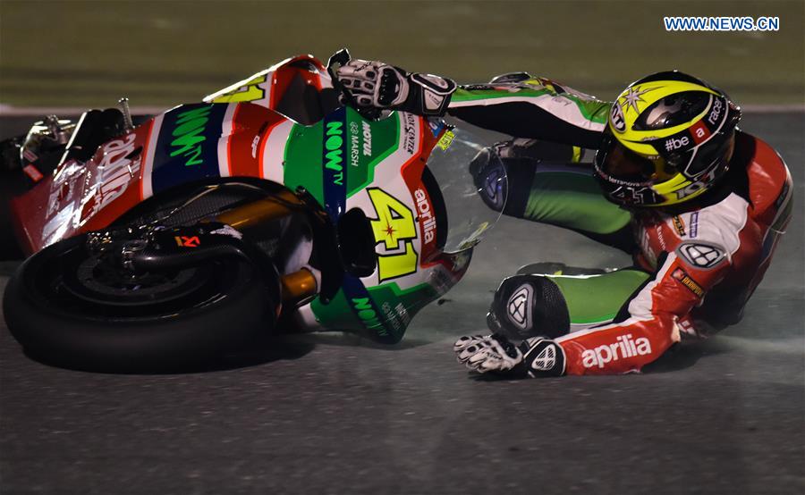 Spanish MotoGP rider Aleix Espargaro of Aprilia Racing Team Gresini falls from his bike during the final day of pre-season test at the Losail International Circuit in Qatar's capital Doha on March 12, 2017, ahead of Grand Prix of Qatar which will be held from March 23 to 26. 
