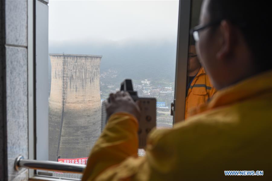 Photo taken on March 17, 2017 shows the demolition of a cooling tower of a power station in Guiyang City of southwest China's Guizhou Province. (Xinhua/Liu Xu) 