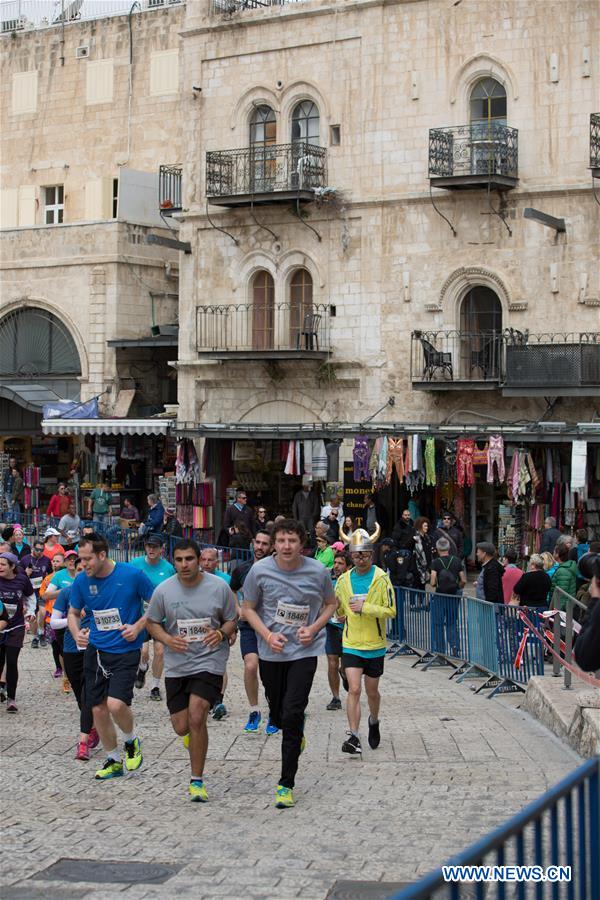 Runners take part in the 7th International Jerusalem Winner Marathon in Jerusalem, on March 17, 2017. (Xinhua/Guo Yu)