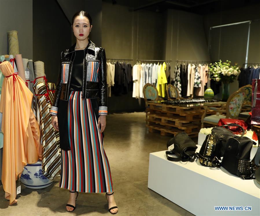 A model presents a creation of designer Zhang Yichao at an inauguration ceremony of an incubator of fashion and innovative talents in Hangzhou, capital of east China's Zhejiang Province, March 17, 2017. The talents incubator is jointly developed by fashion college of Zhejiang Sci-tech University, School of Fashion of Wuhan Textile University and a customization platform. (Xinhua/Chen Jianli) 
