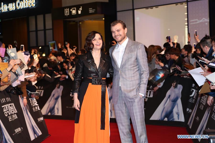 Actor Pilou Asbaek (R) and actress Juliette Binoche attend a red carpet for the film 'Ghost in the Shell' promotion tour in Seoul, South Korea, on March 17, 2017. (Xinhua/Lee Sang-ho) 