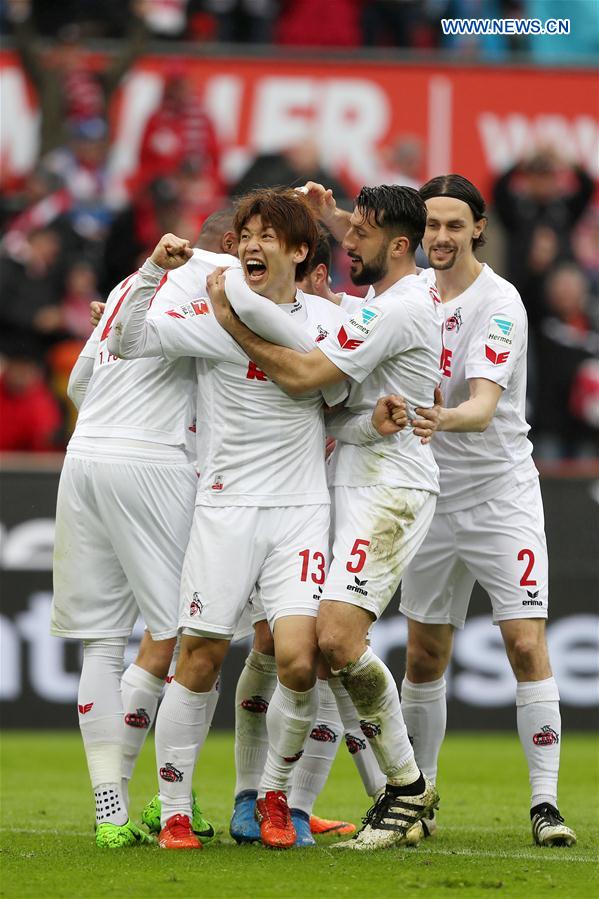 Yuya Osako (2nd L) of 1. FC Koeln celebrates after scoring during the Bundesliga match between 1. FC Koeln and Hertha BSC in Cologne, Germany, on March 18, 2017. 