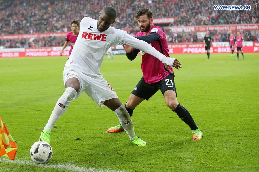 Anthony Modeste (L) of 1. FC Koeln vies for the ball during the Bundesliga match between 1. FC Koeln and Hertha BSC in Cologne, Germany, on March 18, 2017. 