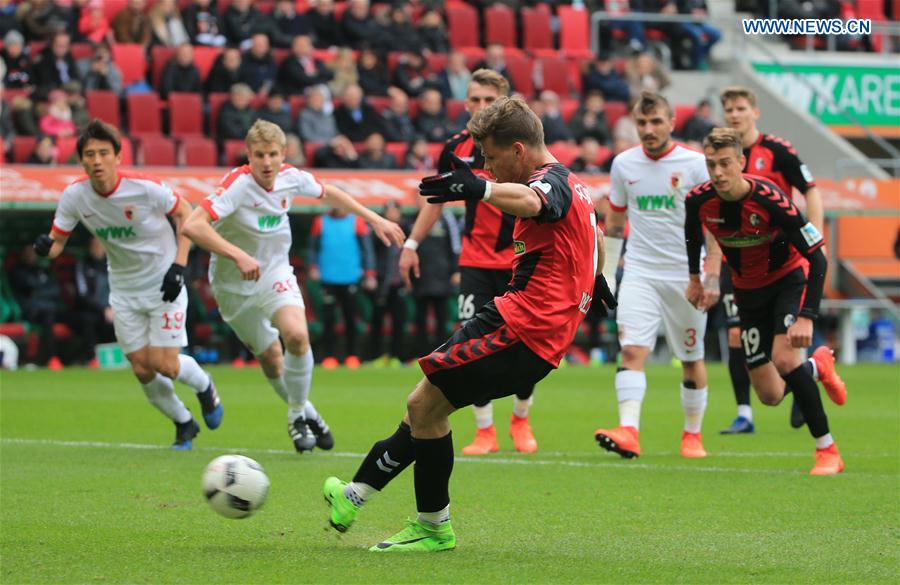 Freiburg's Florian Niederlechner scores a penalty kick during a German Bundesliga match between FC Augsburg and SC Freiburg in Augsburg, Germany, on March 18, 2017. 